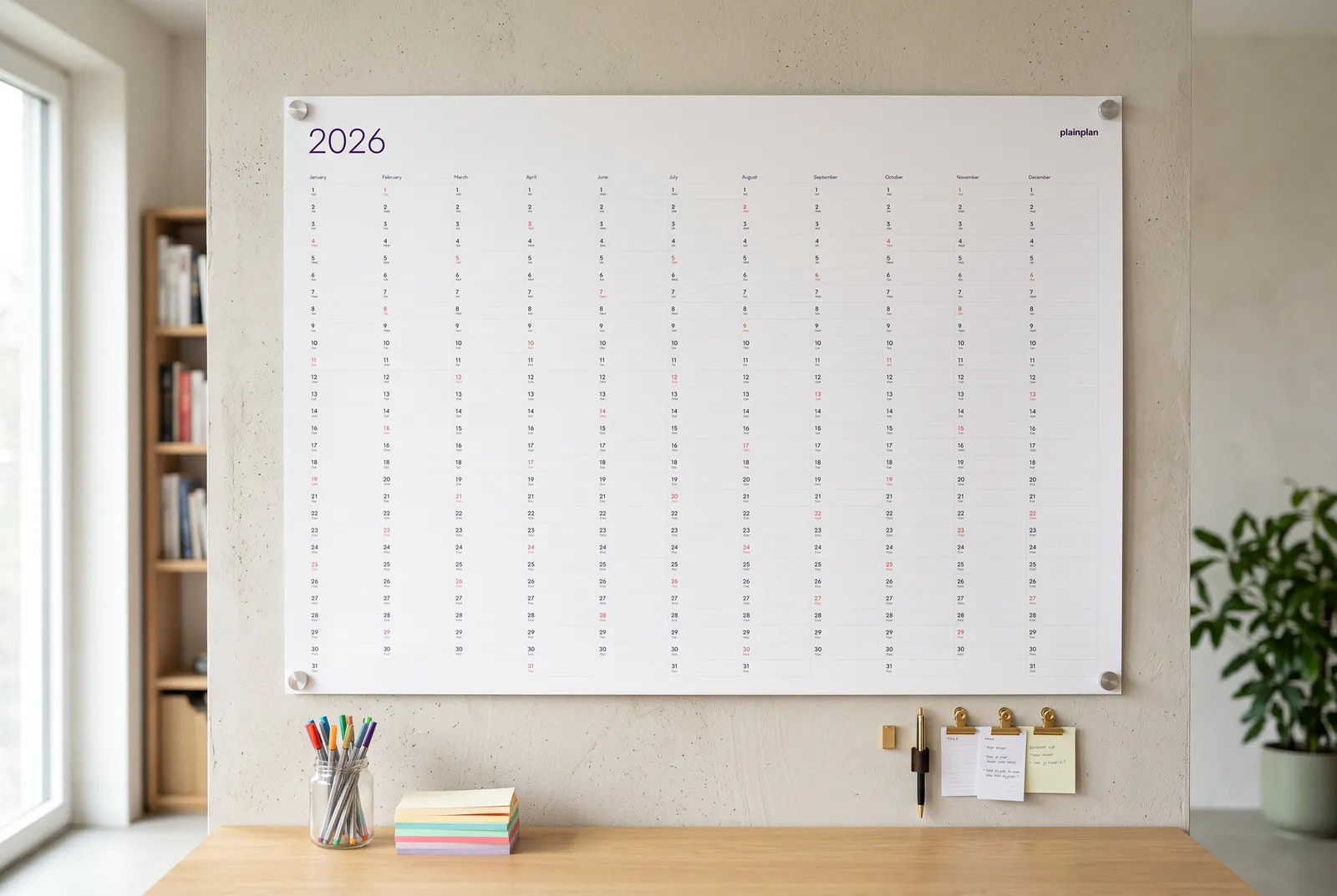 PlainPlan 2027 wall planner hanging in a bright home office