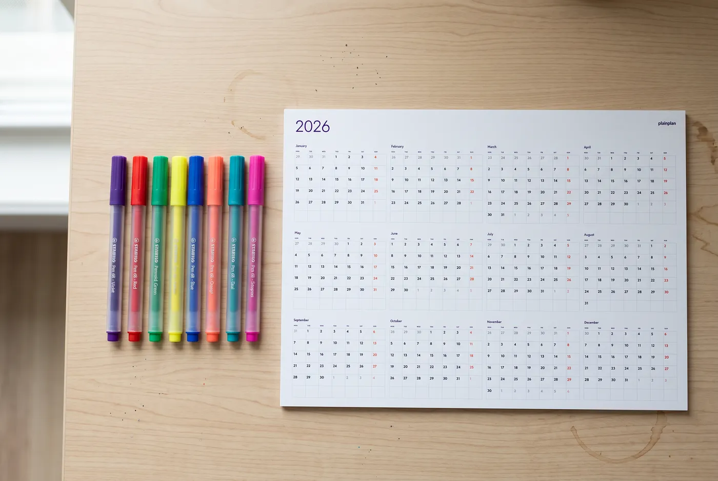 Wall planner with color-coded entries in different colors