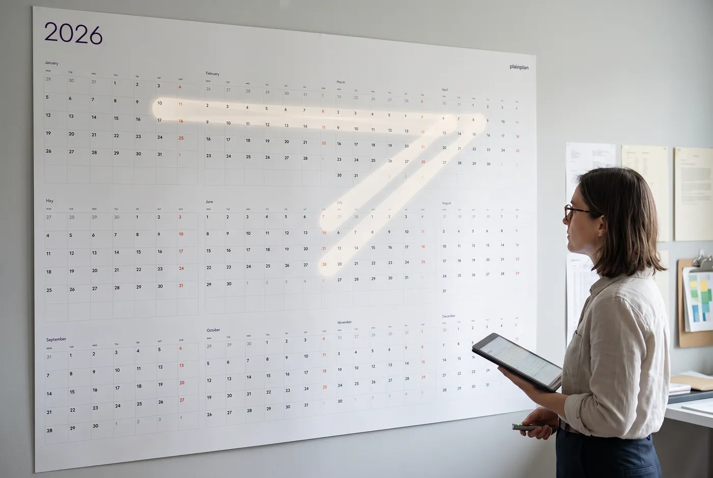Colored markers arranged next to a planner grid for color coding